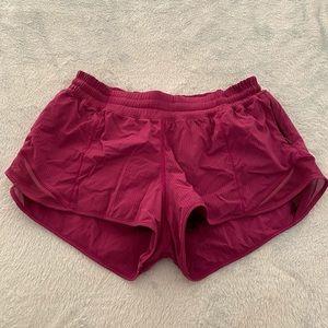 Fuchsia athletic shorts.
